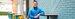 Parkdean manager wearing a blue jacket stood smiling