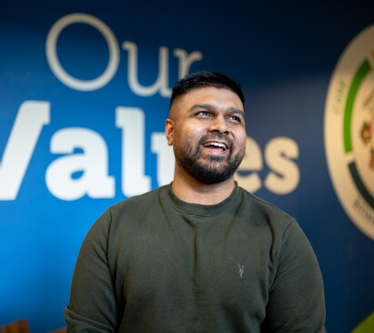 man smiling in the parkdean office