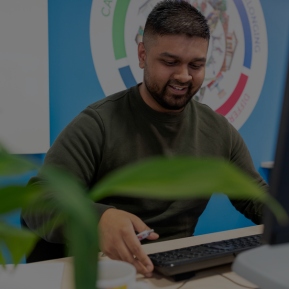 Image of employee sat at a desk