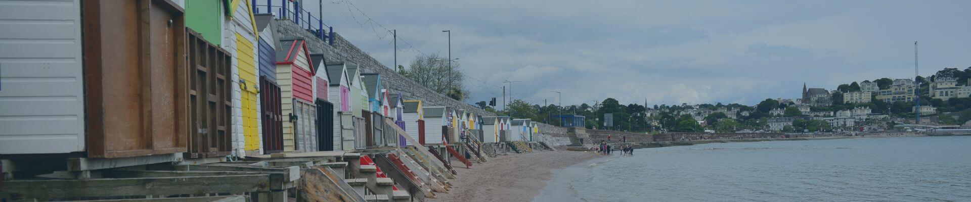 Image of colourful huts along the beach side