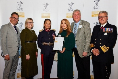 Image of Parkdean resorts team holding the Armed Forces Covenant Gold Award
