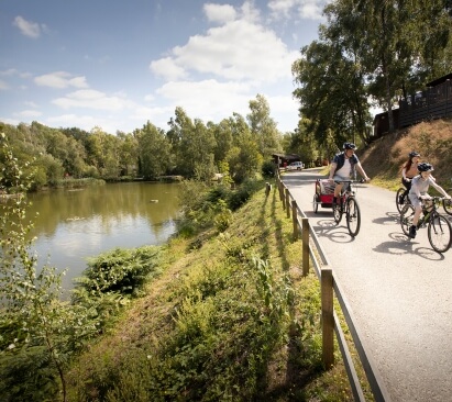 image of people cycling along the river in Warmwell, Devon