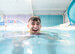 Image of lifeguard laughing while in a swimming pool