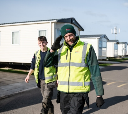 Photo of two maintenance workers on a holiday park