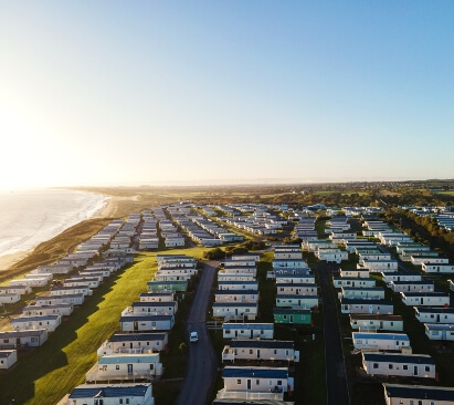 Caravans lined up in a holiday park setting