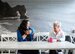 Image of two people chatting over a cup of coffee