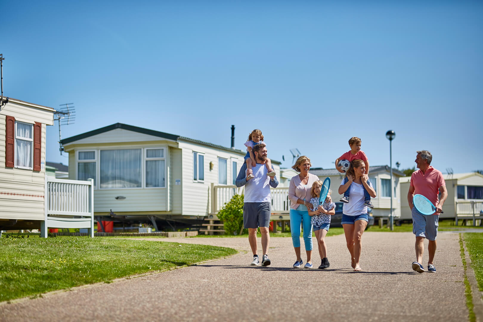 image of a family walking through kessingland beach holiday park