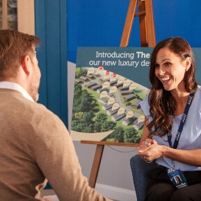 image of a woman enthusiastically discussing holiday home sales