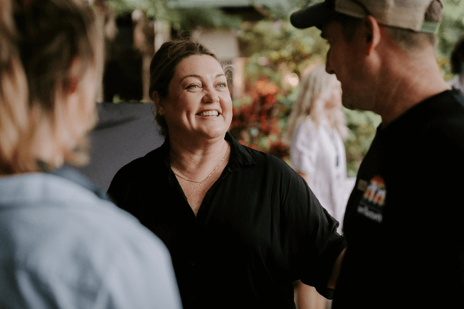 a woman having a drink with friends