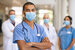 jobs in substance abuse treatment at DBH - nurse with mask and other professionals in background 