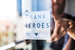 Nurse day concept. Man hands holding lightbox with Thank heroes text thanking doctors, nurses and medical staff working in hospitals 