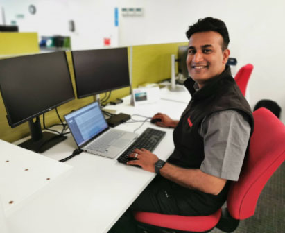 Rentokil colleague at his desk in the office