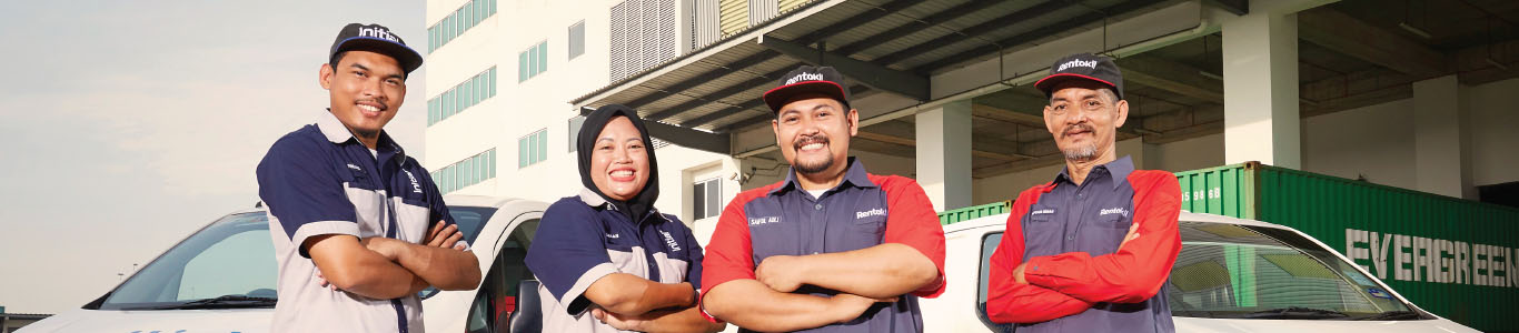 Initial and Rentokil technicians in front of their respective vans