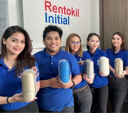 Initial technicians showing different varieties of Signature soap dispensers