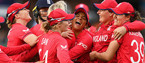 England female cricket team hugging on the pitch