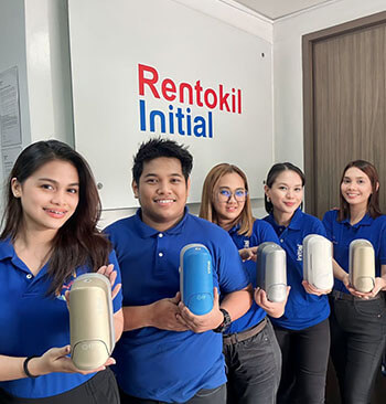 Initial technicians showing different varieties of Signature soap dispensers