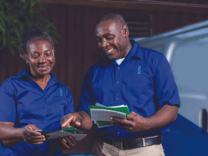 Two Initial technicians sharing documentation