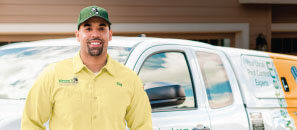 Wester Exterminator technician in front of his van