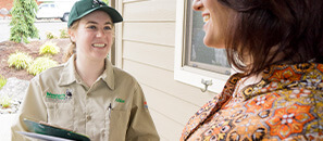 Western Exterminator employee on customer's doorfront for a visit