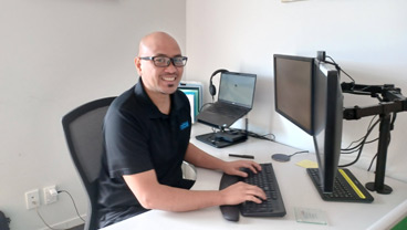 Initial colleague at his desk in the office