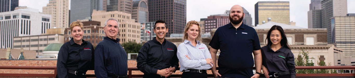 Rentokil and Terminix team with a skyline behind them