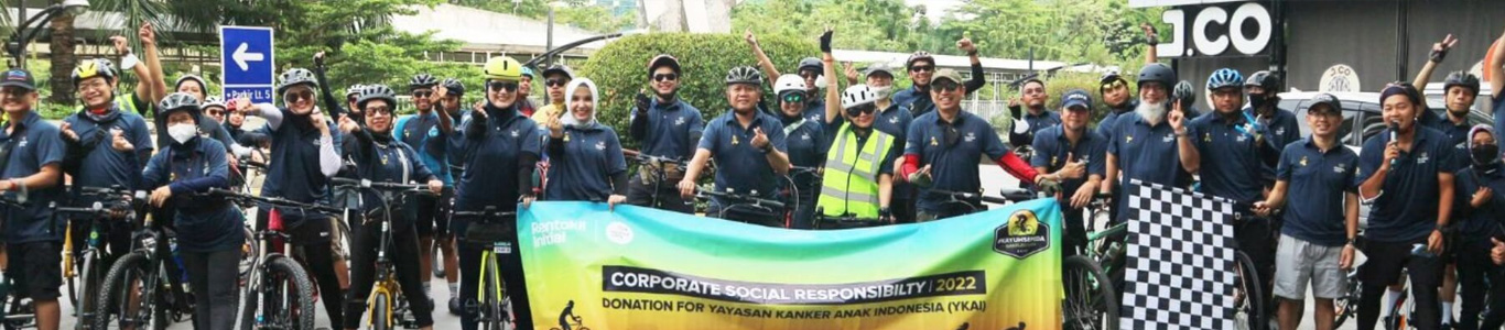 Indonesia colleagues on a bike march for corporate social responsibility