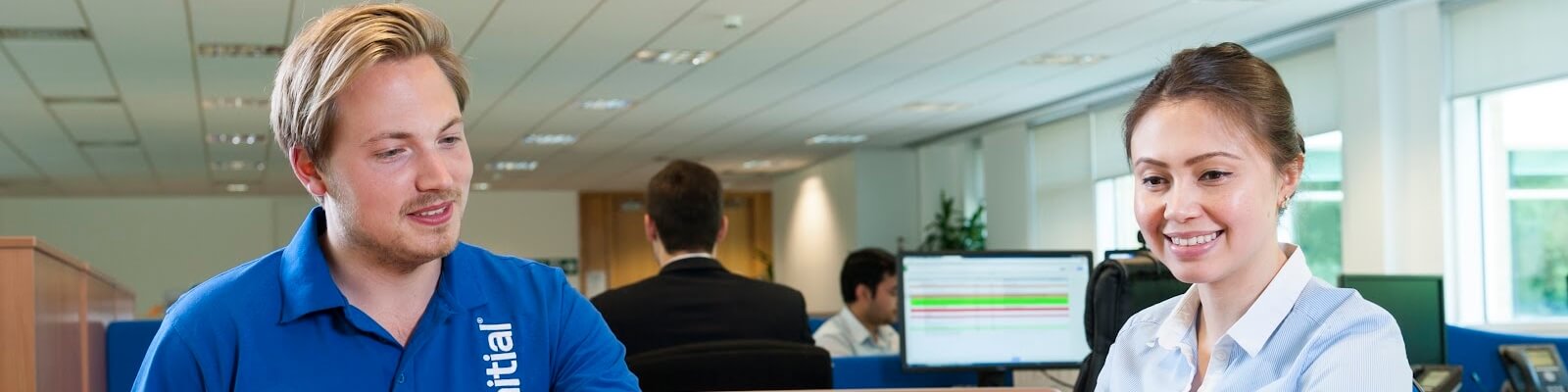 Initial technician speaking with customer at an office