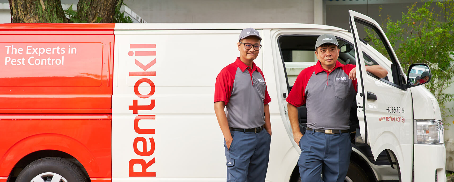Technicians in front of a van