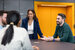 tax professionals sitting on table having a meeting