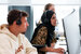 image of customer service rep on phone sitting at computer