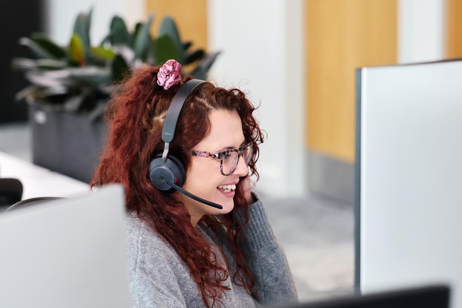 image of underwriter in a meeting virtually looking at computer