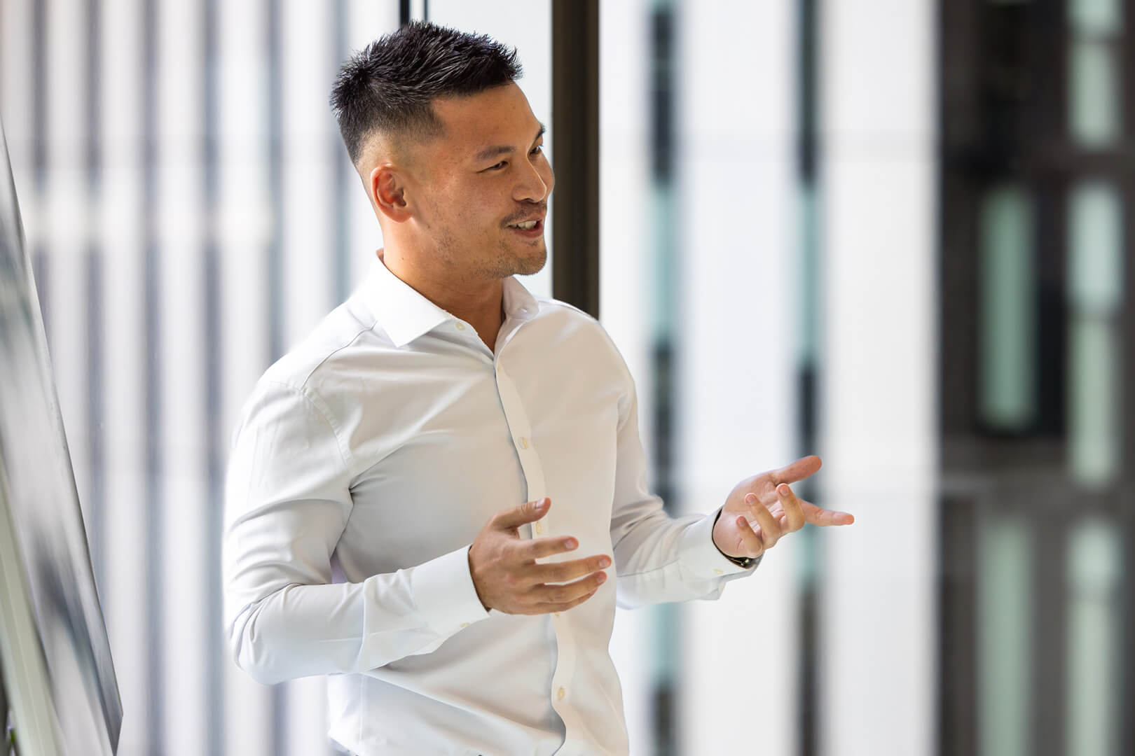 actuary at L&G standing and presenting a meeting 