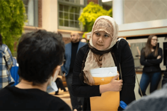  Job fair attendee listening intently