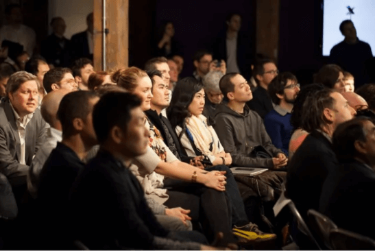 Group of people sitting in the audience at an information session