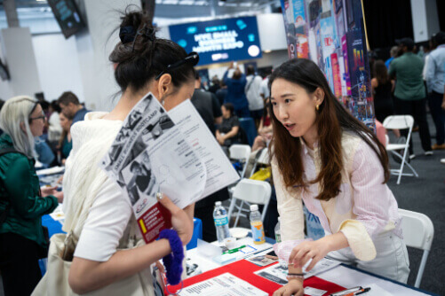 Synchronized swim class at a NYC Parks & Recreation pool. Instructor's shirt reads "Aquatic Specialist, City of New York, Parks & Recreation."