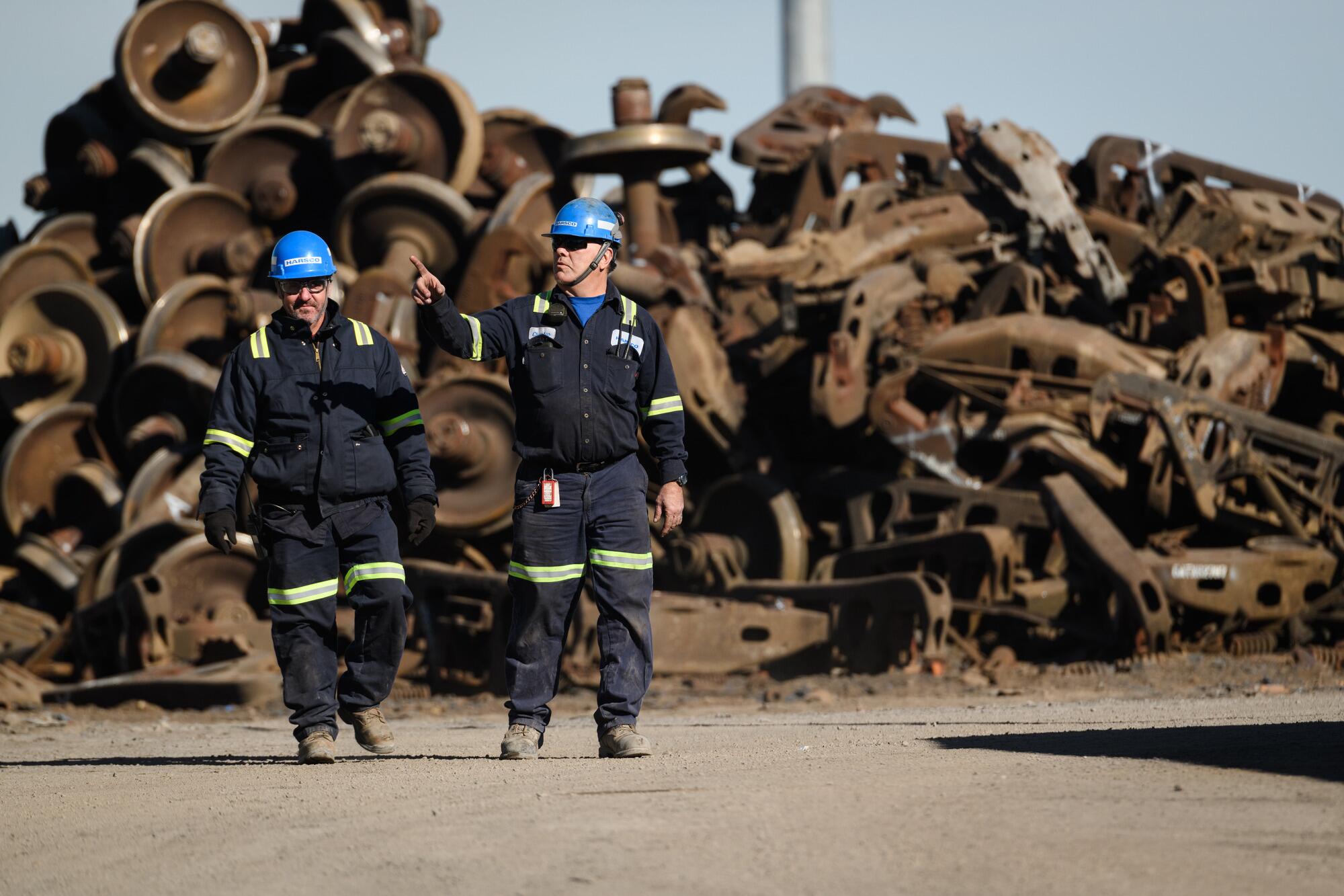 four people in high vis jackets standing on a contruction site