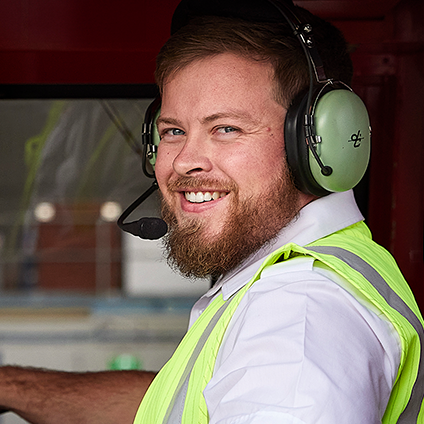 One of our licensed aircraft maintenance engineers smiling at the camera