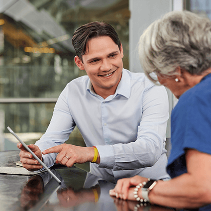 Two employees discussing an idea at a table