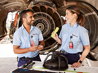 Licensed Aircraft Maintenance Engineer and Apprentice inspecting an aircraft engine, demonstrating technical expertise and hands-on training in aviation maintenance