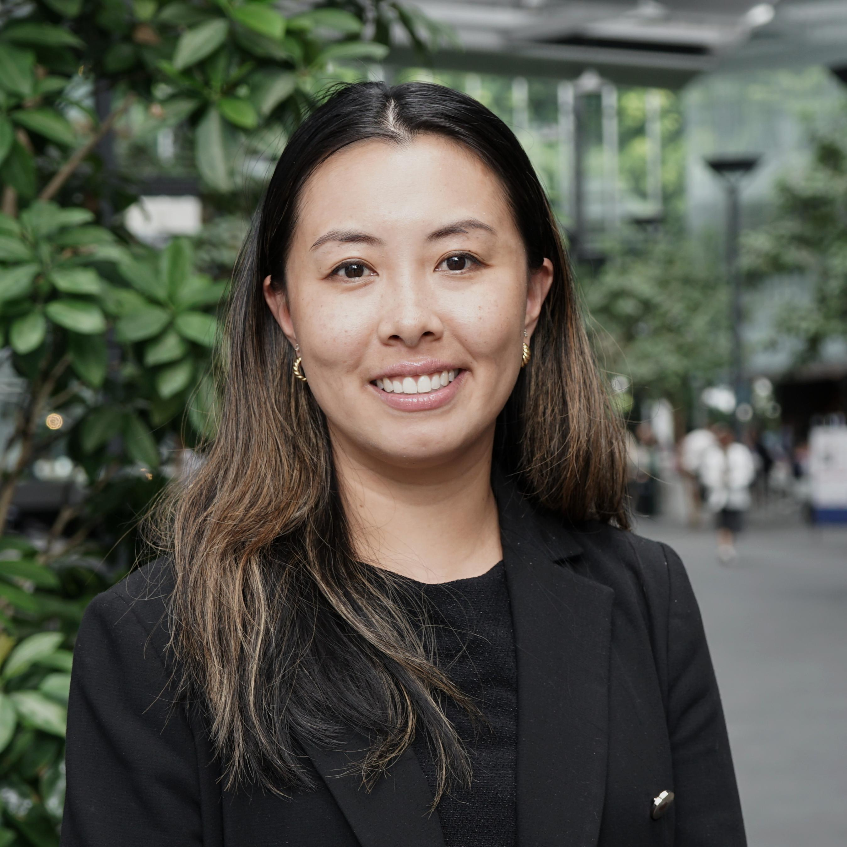 A member of strategic projects team smiling at camera