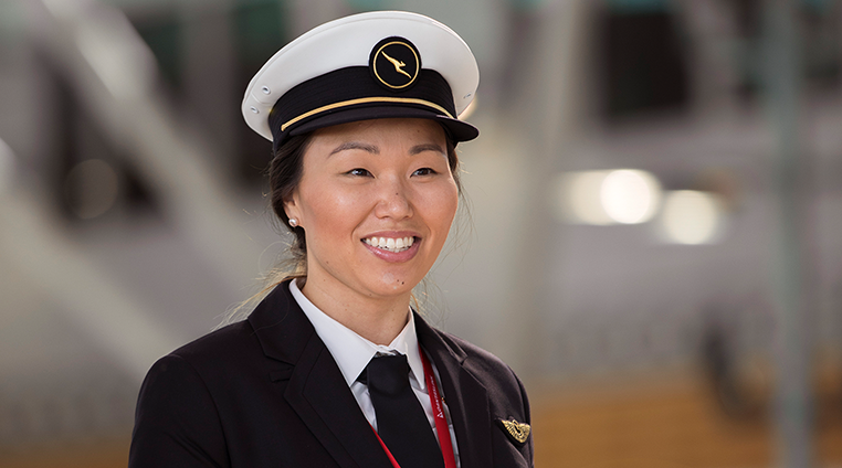 A QantasLink Pilot smiling at camera