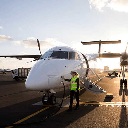 A Qantas aircraft receiving Sustainable Aviation Fuel