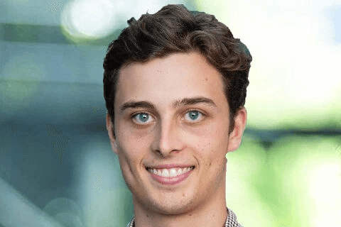 A Qantas Graduate smiling at camera