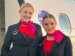 2 QantasLink cabin crew members smiling at camera