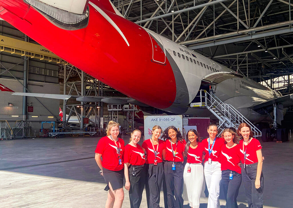 Group of Qantas graduates at Hangar 96