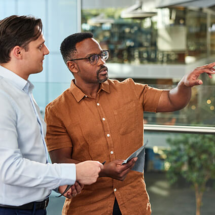 Two employees reviewing strategy together 