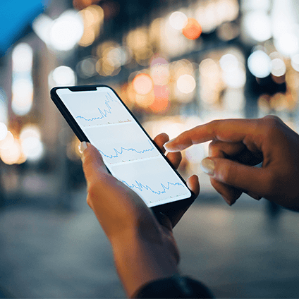 A person looking at analytic charts on their phone