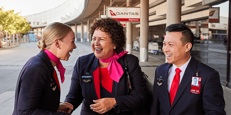 Members of Qantas Cabin Crew team laughing together