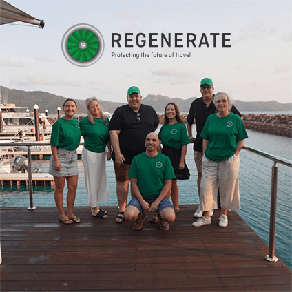 Members of our ReGenerate team in merchandise, smiling at the camera