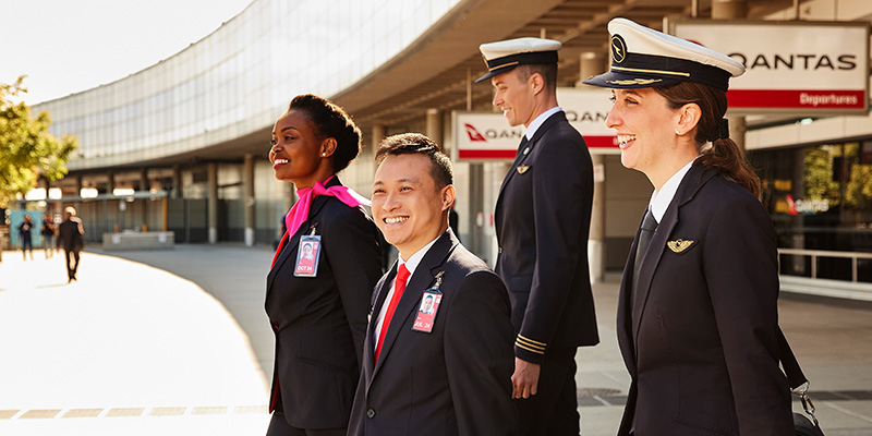 Qantas Cabin Crew and Pilots waking outside Brisbane Airport